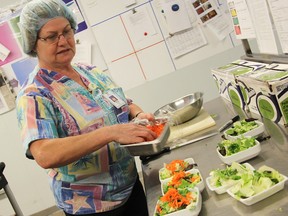 Halina Melady prepares salads Friday in the kitchen at Sarnia's hospital. Bluewater Health has been seeing positive results after last year moving to cook most of the meals it offers in house. Tyler Kula/Sarnia Observer/Postmedia Network