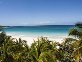 Flamenco Beach is a long crescent of white sand edged by turquoise water on Culebra -- one of the sparsely populated cays off Puerto Rico's east coast. PUERTO RICO TOURISM PHOTO