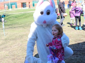 Six-year-old Mila Ferrar shares a moment with the Easter bunny during the Bright's Grove Optimist Club's Easter in the Park.
NEIL BOWEN/ Sarnia Observer