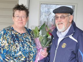 Nancy Ellens, of Mitchell, has been named the Rotary Club of Mitchell’s 2016 Citizen of the Year, for her longtime involvement in the community. She is formally recognized by Dave Williams, Rotary Club president, with this bouquet of flowers at her Eleanor Street home. ANDY BADER/MITCHELL ADVOCATE