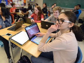 Tsion Samison, 14, Rhen Boyle, 15, Cole Hill, 14, and Noor Elsadi, l-r, use Chromebooks in their Grade 9 french class at Central Secondary School on Monday April 3, 2017. MORRIS LAMONT/THE LONDON FREE PRESS /POSTMEDIA NETWORK