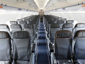 This Thursday, March 16, 2017, file photo shows the interior of a commercial airliner at John F. Kennedy International Airport in New York. Airlines are allowed to oversell flights, and they frequently do, because they assume that some passengers won’t show up. But there are some federal rules that apply. (AP Photo/Seth Wenig, File)