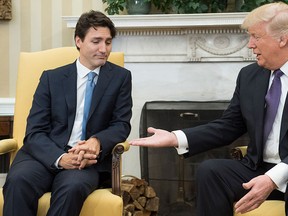 U.S. President Donald Trump (R) extends his hand to Prime Minister Justin Trudeau during a meeting in the Oval Office at the White House on Feb. 13, 2017 in Washington, D.C.  (Kevin Dietsch-Pool/Getty Images)