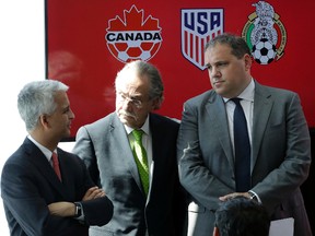 Sunil Gulati, left, President of the United States Soccer Federation, Decio de Maria, centre, President of the Mexican Football Federation, and Victor Montagliani, President of the Canadian Soccer Association, hold a news conference, Monday, April 10, 2017, in New York. (AP Photo/Mark Lennihan)
