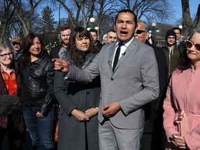 Wab Kinew announces his intention to run for the provincial New Democratic Party leadership during a press conference behind the Manitoba Legislative Building on Broadway in Winnipeg on Mon., April 10, 2017. Kinew's wife, Lisa Monkman, is at his right and MLA Nahanni Fontaine on his left. Kevin King/Winnipeg Sun