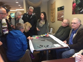 Justine Giancola from Dillon Consulting, centre, talks to local residents about their ideas for the Port Stanley’s harbour during a public meeting April 10. (JONATHAN JUHA/TIMES-JOURNAL/POSTMEDIA NETWORK)