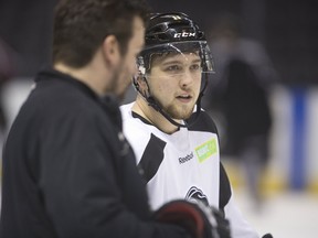 Knights over-ager Owen MacDonald talks with assistant coach Dylan Hunter about face-off techniques during a practice at Budweiser Gardens in London, Ont. on Monday April 10, 2017. Mike Hensen/The London Free Press/Postmedia Networ