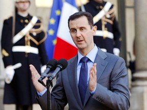 Syria President Bashar al-Assad addresses reporters following his meeting with French President Nicolas Sarkozy at the Elysee Palace in Paris on Dec. 9, 2010. (Remy de la Mauviniere/AP Photo/Files)