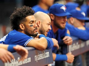 Blue Jays second baseman Devon Travis, left, looks on during a loss to the Tampa Bay Rays Sunday, April 9, 2017, in St. Petersburg, Fla. (AP Photo/Mike Carlson)