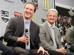 This Jan. 10, 2013 file photo shows Los Angeles Kings president and general manager Dean Lombardi and head coach Darryl Sutter laughing during a news conference to help kick off the NHL hockey team’s season in Los Angeles. (AP Photo/Mark J. Terrill, file)