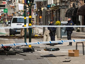 Police attend the scene of the terrorist attack where a truck crashed after driving down a pedestrian street in downtown Stockholm on April 8, 2017 in Stockholm, Sweden. (Photo by Michael Campanella/Getty Images)