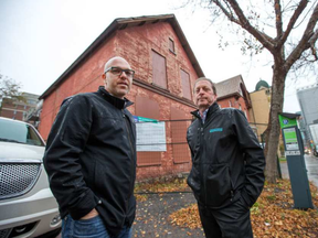 Josh Zaret (L) and Neil Zaret of Gemstone Developments during a tour of an old house located at 234 O'Connor that they want to demolish and eventually replace. (Wayne Cuddington, Postmedia)