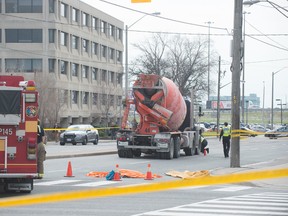 A woman in her 20s has died after being struck by a cement truck while crossing Dufferin Street at Wilson Ave. on Tuesday morning. Toronto Police have closed the intersection as they reconstruct the accident. (VICTOR BIRO)