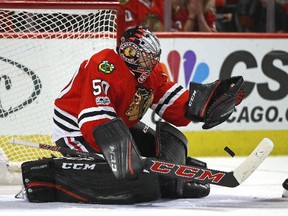 Corey Crawford of the Blackhawks makes a save in overtime against the Dallas Stars at the United Center on March 23, 2017 in Chicago. (Jonathan Daniel/Getty Images)