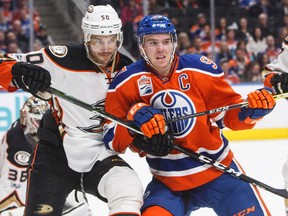 Anaheim Ducks’ Antoine Vermette (50) and Edmonton Oilers’ Connor McDavid (97) vie for position in front of the net in Edmonton Saturday, April 1, 2017. (THE CANADIAN PRESS/Jason Franson)