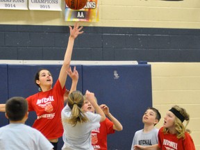 Haley Small of the Clippers goes high to block this shot attempt during action from the senior gold medal final last Wednesday, April 5, a 20-16 win over the Spurs. ANDY BADER/MITCHELL ADVOCATE