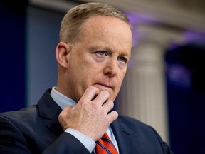White House press secretary Sean Spicer pauses while talking to the media during the daily press briefing at the White House in Washington, Tuesday, April 11, 2017. (AP Photo/Andrew Harnik)