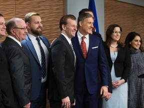 Maxime Bernier (third from right in blue suit), leadership candidate for the Conservative Party of Canada, receives the endorsement of nine members of the Alberta Legislative Assembly, during a press conference at the Matrix Hotel, 10640 100 Ave., in Edmonton Tuesday April 11, 2017.
