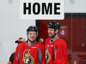 Mark Borowiecki and Marc Methot have a laugh as the Ottawa Senators practice at the Bell Sensplex on April 11, 2017. (Wayne Cuddington/Postmedia)