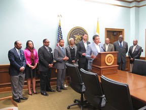 Columbus, Ohio, Mayor Andrew Ginther, front centre, joined by city officials and council members expresses his concern Tuesday, April 11, 2017, over a police officer captured on video apparently kicking a handcuffed suspect in the head. (AP Photo/Andrew Welsh-Huggins)