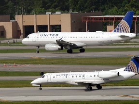 After a man is dragged off a United Express flight on Sunday, United Airlines became the butt of jokes online and on late-night TV. (David J. Phillip/AP Photo/FIles)