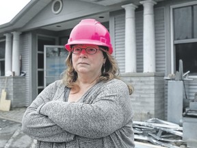 Maggie McLaren stands outside the renovation site of the new Dawn House facility in Kingston’s west end on Tuesday afternoon, two days after the property had been vandalized. (Taylor Bertelink/For The Whig-Standard, Postmedia Network)