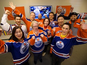 Employees at Psychometrics cheer on the Edmonton Oilers, on Tuesday April 11, 2017. Psychometrics' has challenged CPP, Inc. (based in the San Jose area) to a wager. The president in the losing team's city must wear a jersey of the winning team, and make a contribution to a local charity while in the winning team's colours.