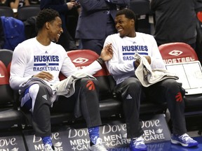 DeMar DeRozan and Kyle Lowry of the Raptors chat on the bench before tipoff where Toronto took on the Miami Heat on April 7, 2017. (Michael Peake/Toronto Sun/Postmedia Network)