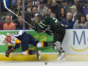 London Knights forward Adrian Carbonara wipes out Erie Otters forward Patrick Fellows during the first period of Game 3 of their OHL Western Conference semifinal at Budweiser Gardens on Tuesday night. The Otters won 3-1 to go up 2-1 in the best-of-seven series. (MORRIS LAMONT/THE LONDON FREE PRESS)