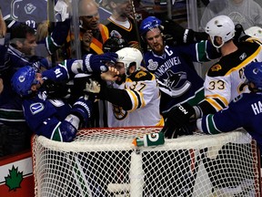 Then with the Vancouver Canucks, Alex Burrows (left) went unpunished for biting the finger of Boston Bruins’ Patrice Bergeron during the 2011 Stanley Cup final. (GETTY IMAGES)