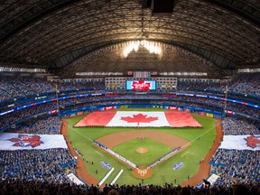 A flag is seen at the home opener for the Toronto Blue Jays as they take on the Milwaukee Brewers at the Rogers Centre on April 11, 2017. (POOL PHOTO)
