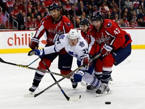 Capitals players swarm Kasperi Kapanen of the Toronto Maple Leafs (Getty Images)