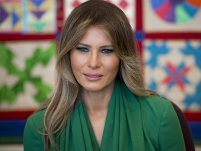 US First Lady Melania Trump talks with students during a visit with Jordan's Queen Rania to the Excel Academy Public Charter School in Washington, DC, April 5, 2017. / AFP PHOTO / SAUL LOEBSAUL LOEB/AFP/Getty Images