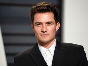 This Feb. 26, 2017, file photo, shows Orlando Bloom at the Vanity Fair Oscar Party in Beverly Hills, Calif. Bloom told Elle U.K. for an interview published online April 11, 2017, that he remains friends with ex-girlfriend Katy Perry and says he and Perry are setting an example by showing that breakups “don’t have to be about hate.” (Photo by Evan Agostini/Invision/AP, File)