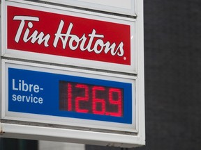 A sign for gas prices is shown at a filling station in Montreal, Wednesday, April 12, 2017. THE CANADIAN PRESS/Graham Hughes