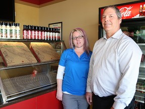 Kelly Toppazzini, co-CEO of  Topper's Pizza, and Kimberly Blanchard, manager of Topper's customer care centre, are involved in the Feel Good Meal campaign to raise money for The Hospital for Sick Children (SickKids) in Toronto. (John Lappa/Postmedia Network)