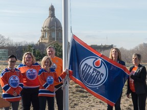 Premier Rachel Notley in Edmonton raising the Oilers flag on April 12,  2017. The Calgary Flames flag was raised in Calgary at the same time by Finance Minister Joe Ceci. Both Alberta NHL hockey teams are in the NHL playoffs starting tonight.  Photo by Shaughn Butts / Postmedia