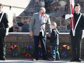 Robert Snelgrove and his grandson Luke Guenthner lay a wreath at the cenotaph, during a ceremony for the Battle of Vimy Ridge's 100th Anniversary with the Royal Canadian Legion Branch 11 on Sunday, April 9. Taylor Hermiston/Vermilion Standard/Postmedia Network.