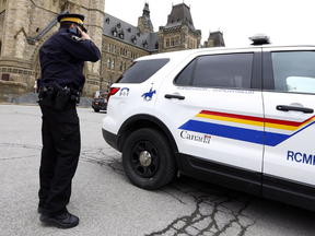 An RCMP constable is shown on Parliament Hill in Ottawa, Wednesday, April 12, 2017, wthout the yellow stripe on his pants.