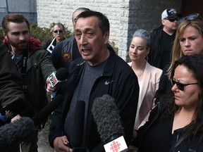 With wife Melinda at his side, George Wood speaks with media during a gathering at St. Mary's Parish on Burrows Avenue in Winnipeg on Wed., April 12, 2017. Kevin King/Winnipeg Sun