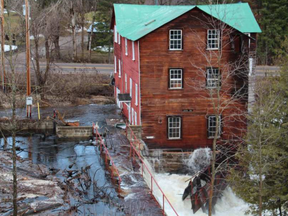 Water from Brennan's Creek floods through historic mill in Killaloe this week. Lynn Flokstra photo