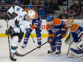 Edmonton Oilers forward Mark Letestu and goalie Cam Talbot watch Patrick Marleau of the San Jose Sharks in front of the net at Rexall Place in Edmonton on March 8, 2016. (Shaughn Butts)