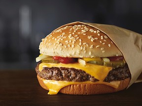 This image provided by McDonald’s Corporation shows a Quarter Pounder burger. (Courtesy of McDonald’s Corporation via AP)