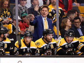 Bruins head coach Bruce Cassidy talks to his players during the third period of their loss to the Capitals in Boston on April 8, 2017. (AP Photo/Winslow Townson)