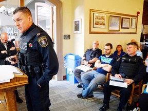 Luke Hendry/The Intelligencer
Belleville Police Chief Ron Gignac discusses mental health awareness for officers at city hall Tuesday. At far left is Mayor Taso Christopher, who chairs the city's police services board. At far right is Deputy Chief Michael Callaghan.