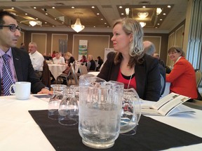 Mehdi Sheikhazadeh, dean of applied research and innovation at Lambton College, visits with Stanfanie Bunko, coordinator of the Lambton Energy Research Centre, before the start of Friday's Sarnia-Lambton Water Symposium at the college's Event Centre. The one-day symposium attracted more than 100 people to a dozen presentations on water and waste water research and technology.
 Paul Morden/Sarnia Observer/Postmedia Network