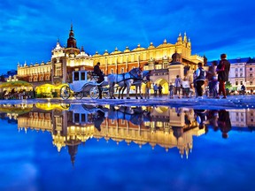 A rain puddle reflects the floodlit charm of Cloth Hall, one of several noteworthy buildings on Krakow's Main Market Square.
DOMINIC ARIZONA BONUCCELLI PHOTO