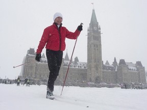 Senator Nancy Greene skies around the front lawn of the Parliament buildings during an event promoting the National Health and Fitness day in Ottawa on February 24, 2016. Sen. Nancy Greene Raine, Canada's most decorated ski racer, is undergoing treatment for thyroid cancer. Sun Peaks Resort, where Greene Raine is the director of skiing, says she is having her thyroid removed today in Kelowna, B.C. (THE CANADIAN PRESS/Adrian Wyld)