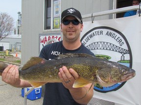 In this file photo, Kevin Ewart of Corunna holds a 9.6-pound walleye at the Bluewater Anglers Salmon Derby weigh-in station on April 30, 2016 in Sarnia. It was the largest walleye caught during last year's derby. This year's derby is scheduled to run April 28 to May 7.
File photo/Sarnia Observer/Postmedia Network