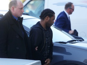 Kingston police escort Mark Anthony Bollers of Toronto into court in Kingston, Ont. on Thursday, April 13, 2017 for bail court as he faces charges related to a local home invasion in February. 
Elliot Ferguson/The Whig-Standard/Postmedia Network